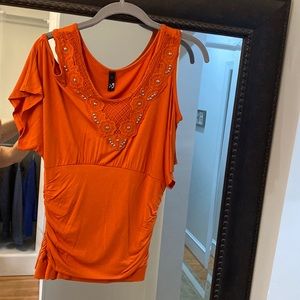 Large orange with detail on front. Like new
